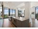 Modern kitchen with large windows, countertops, and stainless steel appliances offers city views at 3107 Peachtree Ne Rd # 2003 Aka Ph3, Atlanta, GA 30305