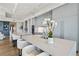 The kitchen includes an island with bar seating, light gray cabinetry and stainless appliances at 3107 Peachtree Ne Rd # 2003 Aka Ph3, Atlanta, GA 30305