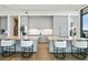 The kitchen provides an island with seating, and modern appliances and fixtures at 3107 Peachtree Ne Rd # 2003 Aka Ph3, Atlanta, GA 30305