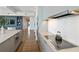 Open kitchen features sleek countertops, modern appliances, and flows seamlessly into the living area at 3107 Peachtree Ne Rd # 2003 Aka Ph3, Atlanta, GA 30305