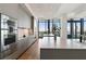 Modern kitchen featuring stainless steel appliances and an island with barstool seating at 3107 Peachtree Ne Rd # 2003 Aka Ph3, Atlanta, GA 30305