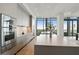 Modern kitchen with sleek cabinets, stainless steel appliances, and eat-in island at 3107 Peachtree Ne Rd # 2003 Aka Ph3, Atlanta, GA 30305