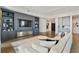 Open concept living room with built-in shelving and hardwood floors in condo at 3107 Peachtree Ne Rd # 2003 Aka Ph3, Atlanta, GA 30305