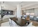 Bright living room features hardwood floors, modern gray built-ins, and an open floor plan at 3107 Peachtree Ne Rd # 2003 Aka Ph3, Atlanta, GA 30305