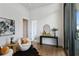 Stylish living room with hardwood floors, elegant decor, and floor to ceiling windows at 3107 Peachtree Ne Rd # 2003 Aka Ph3, Atlanta, GA 30305