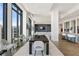 Spacious open-plan living and dining area with modern decor and panoramic city views at 3107 Peachtree Ne Rd # 2003 Aka Ph3, Atlanta, GA 30305