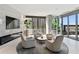 Modern lounge featuring city views, comfortable furniture, and beautiful accent pieces at 3107 Peachtree Ne Rd # 2003 Aka Ph3, Atlanta, GA 30305