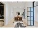Bright office space with modern glass doors, sleek desk, and decorative rug creating a stylish work environment at 3107 Peachtree Ne Rd # 2003 Aka Ph3, Atlanta, GA 30305