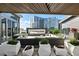 Elegant outdoor living space with comfortable seating, fireplace, and city views, ideal for year-round enjoyment at 3107 Peachtree Ne Rd # 2003 Aka Ph3, Atlanta, GA 30305