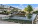 Stunning rooftop deck featuring a water feature, lounge seating, and lush greenery, perfect for relaxation and entertaining at 3107 Peachtree Ne Rd # 2003 Aka Ph3, Atlanta, GA 30305