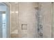 Close-up of a modern shower featuring a rainfall shower head, handheld sprayer, and built-in niche at 3107 Peachtree Ne Rd # 2003 Aka Ph3, Atlanta, GA 30305
