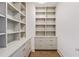 Spacious walk-in closet offers ample storage with custom shelving and drawers at 3107 Peachtree Ne Rd # 2003 Aka Ph3, Atlanta, GA 30305
