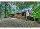 Lush backyard showcasing a house, blending comfort with outdoor serenity at 8350 Gledstone Way, Fairburn, GA 30213