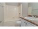 Clean bathroom with vanity and shower-tub combo at 8350 Gledstone Way, Fairburn, GA 30213