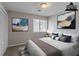 Staged bedroom boasts decor and a neutral color palette at 8350 Gledstone Way, Fairburn, GA 30213