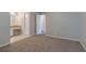 Spacious bedroom features soft carpet and neutral paint, ready for your personal touch at 8350 Gledstone Way, Fairburn, GA 30213