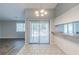 Bright dining area with sliding doors and tile flooring, offering a seamless flow to the outdoors at 8350 Gledstone Way, Fairburn, GA 30213