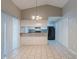 Cozy dining area with tile flooring, pendant lighting, and access to the kitchen and backyard at 8350 Gledstone Way, Fairburn, GA 30213