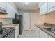 Efficient kitchen with white cabinets, practical layout, and ample storage space for all your needs at 8350 Gledstone Way, Fairburn, GA 30213