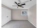 Spacious bedroom with a ceiling fan, carpeted floor, and neutral color scheme at 3017 Lana Ln, Marietta, GA 30066