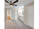 Spacious bedroom with a ceiling fan, carpeted floor, and neutral color scheme at 3017 Lana Ln, Marietta, GA 30066