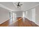 Open bedroom featuring wood floors, vaulted ceiling, and multiple doors at 3017 Lana Ln, Marietta, GA 30066