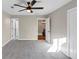 Spacious bedroom with a ceiling fan, carpeted floor, and neutral color scheme at 3017 Lana Ln, Marietta, GA 30066
