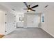 Spacious bedroom with a ceiling fan, carpeted floor, and neutral color scheme at 3017 Lana Ln, Marietta, GA 30066