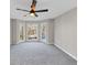 Spacious bedroom features a ceiling fan and beautiful bay windows with neighborhood views at 3017 Lana Ln, Marietta, GA 30066