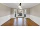 Traditional dining room with hardwood floors, wainscoting, and a bay window for natural light at 3017 Lana Ln, Marietta, GA 30066