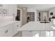 Contemporary kitchen showcases an island with sink, stainless fridge, bright countertops, and ample storage at 3017 Lana Ln, Marietta, GA 30066