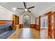 Inviting living room with hardwood floors, a fireplace, and an arched window with a view at 3017 Lana Ln, Marietta, GA 30066