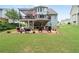 Spacious backyard with a brick patio and two-story deck, offering ample space for outdoor enjoyment at 3480 Arbroath Dr, Douglasville, GA 30135