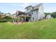 Large backyard featuring a deck with pergola and stone patio, ideal for outdoor living and entertaining at 3480 Arbroath Dr, Douglasville, GA 30135