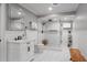 Bright bathroom featuring tiled walk-in shower, modern vanity, large mirror and neutral color palette at 3480 Arbroath Dr, Douglasville, GA 30135