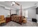 Bedroom featuring a four-poster bed, neutral walls, ceiling fan, and a window to let in natural light at 3480 Arbroath Dr, Douglasville, GA 30135