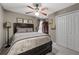 Neutral bedroom offering a plush bed, double closet, and ambient lighting with decor to create a relaxing space at 3480 Arbroath Dr, Douglasville, GA 30135