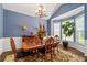 Elegant dining room with large windows, chandelier, and classic decor at 3480 Arbroath Dr, Douglasville, GA 30135