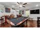 Spacious game room features a pool table, a wet bar, and ample seating for entertainment and recreation at 3480 Arbroath Dr, Douglasville, GA 30135