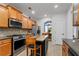 Well-equipped kitchen featuring stainless steel appliances, center island, and dining area view at 3480 Arbroath Dr, Douglasville, GA 30135