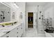 Bright main bathroom featuring double vanity, marble floors, and glass shower at 3480 Arbroath Dr, Douglasville, GA 30135