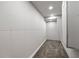 Unfinished storage room with carpeted floor, white walls and ceiling with recessed lighting at 3480 Arbroath Dr, Douglasville, GA 30135
