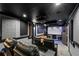 Home theater room with comfortable seating, a large screen, and surround sound for an immersive experience at 3480 Arbroath Dr, Douglasville, GA 30135
