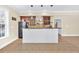 Stylish home bar featuring dark cabinets, granite countertops, and a white bar at 3865 Pointer Rd, Loganville, GA 30052