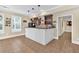 Stylish home bar featuring dark cabinets, granite countertops, and a white bar at 3865 Pointer Rd, Loganville, GA 30052