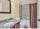 Well-lit bathroom featuring a granite vanity, shower with curtain, and tiled floors at 3865 Pointer Rd, Loganville, GA 30052