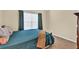 Bedroom with a king bed and a lot of natural light from the window at 3865 Pointer Rd, Loganville, GA 30052