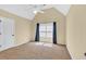 This carpeted bedroom features a window for natural light, and a vaulted ceiling at 3865 Pointer Rd, Loganville, GA 30052