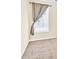 Neutral bedroom with window dressed with light-filtering curtains and beige carpet at 3865 Pointer Rd, Loganville, GA 30052