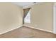 Neutral bedroom with window dressed with light-filtering curtains and beige carpet at 3865 Pointer Rd, Loganville, GA 30052